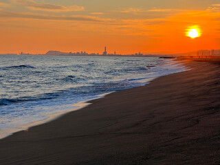 View of Barcelona at sunset in winter with lonely beaches, Mediterranean sea, El Masnou, Catalonia.