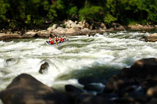 Image of rafters in the Fayette Station rapids on the New River at Fayetteville, West Virginia.