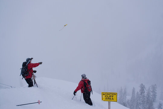A ski patroller throwing explosives for avalanche control at Squaw Valley in California.