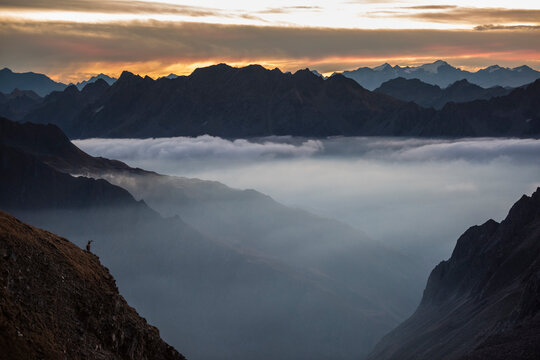 Small silhouette of ibex at sunrise at mountains, Verbano-Cusio-Ossola, Italy