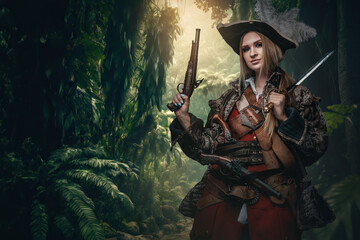 Naklejka premium Portrait of buccaneer woman with pistols and hat in jungle of tropical island.