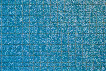 Blue safety wired glass texture. Macro shot.