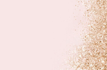 Gold sparkles on pink background. Light pink minimalistic festive glamorous background with scattered golden metal glitter in delicate pastel colors.