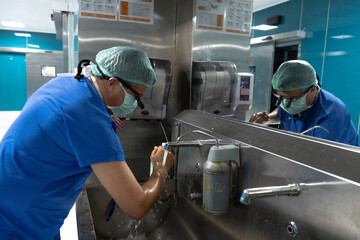 The doctor is preparing for surgery. Doctor sterilizing by washing hands before surgery