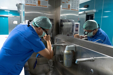 The doctor is preparing for surgery. Doctor sterilizing by washing hands before surgery