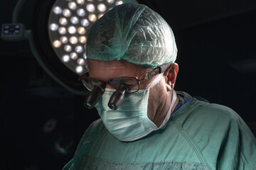 Open heart surgery, doctors and cardiologists perform open heart surgery. Doctors in green uniforms...