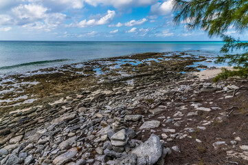 A view across a beach on the island of Eleuthera, Bahamas on a bright sunny day