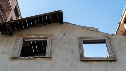 Ruined house during the process of urban transformation. Demolition of old buildings. Building demolition in urban transformations