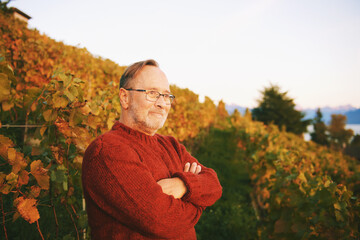 Outdoor portrait of middle age man posing in autumn vineyard - 565328185