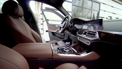 Closeup Of Hand Of Worker Wipe And Polish interior of the car