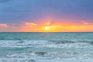 Waves and sunset at South Beach in Miami, United States