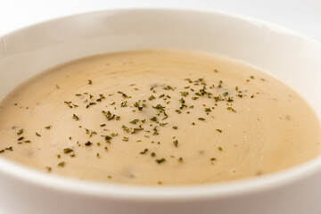 Mushroom cream soup on a white background