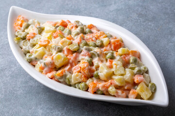 Russian salad Olivier with mayonnaise and egg served (Turkish name; Rus salatasi)