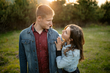 Fototapeta premium Happy partners on a getaway kissing, smiling and relaxing outdoors enjoying and loving the sunlight