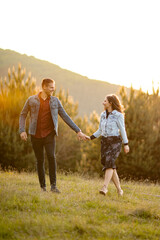 Valentine's Day celebrated by a young couple by walking in nature