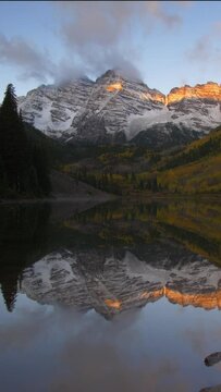 Maroon bells lake near Snowmass Colorado in vertical video format with the Elk Mountains in the background.