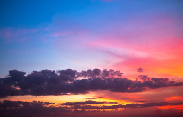 Fototapeta premium beautiful gradient orange and ranibow colour clouds and sunlight on the blue sky perfect for the background, take in everning,Twilight