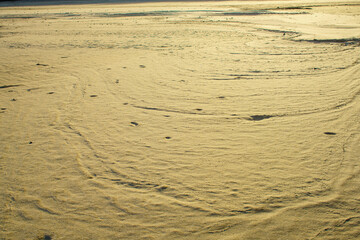 Natural background texture of frozen sand.