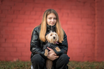 Portrait of a young beautiful girl with a dog.