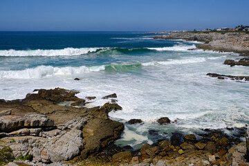 Fototapeta na wymiar Coastline and breaking waves at Hermanus, Western Cape, South Africa