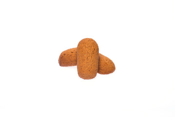 Three cookies partially covered with icing on a clean white isolated background.