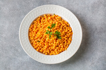 Couscous pilaf with tomatoes. Turkish name; domatesli kuskus pilavi