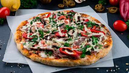 Italian pizza with beef, mushrooms, tomatoes, sweet peppers, onions, cheese and parsley.