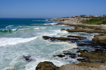 Fototapeta na wymiar Breaking waves and coastline at Hermanus, Western Cape, South Africa