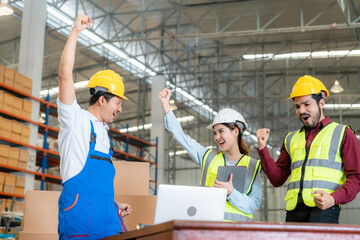 Happy employees celebrating together at warehouse