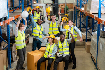 Raised angle portrait group photo of workers inside a food distribution warehouse