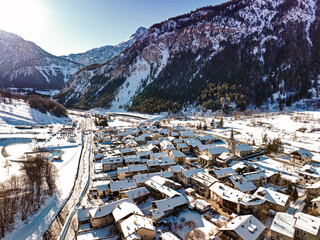 Panoramic view of Bardonecchia village from above, ski resort in the italian western Alps, Piedmont, Italy. Bardonecchia, Italy - January 2023