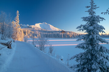 The crisp, clear winter morning at Strbske Pleso, with the High Tatras looming above the frozen lake