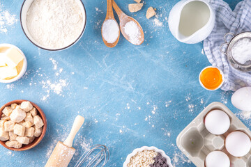 Baking ingredients background. Cooking ingredients (flour, eggs, milk, brown sugar, butter) with utensils on light blue background top view copy space - Powered by Adobe
