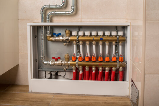 Central floor heating plumbing valves unit in the bathroom