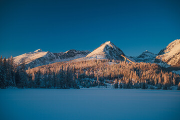 The High Tatras in all their winter glory, captured at sunrise at Strbske pleso lake.