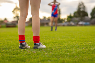 low angle shot of football players legs on field