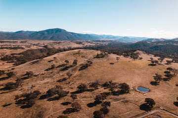 Aerial landscape of rolling countryside and mountains, on the outskirts of Canberra ACT.