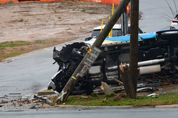 View of flipped truck after hitting a utility pole. No one hurt in single vehicle accident!