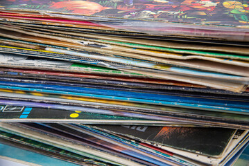 Group of old vinyl singles in original sleeves, 7 inches records covers.