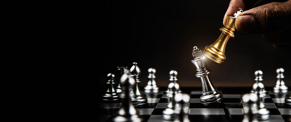 Hand choose king chess piece concepts of fighting challenge of leader business team or teamwork...