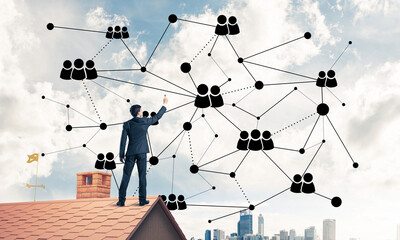 Businessman on house roof presenting networking and connection c