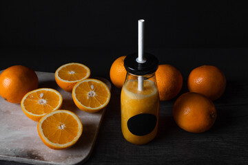 Orange, juicy fruits isolated on black background. Fresh juice.