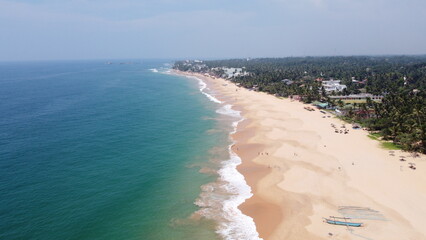 Sri Lanka Southern beaches captured by a drone. Indian blue ocean with clear blue sky, warm tropical temperature, 
