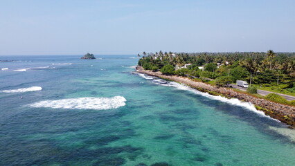 Sri Lanka Southern beaches captured by a drone. Indian blue ocean with clear blue sky, warm tropical temperature, 