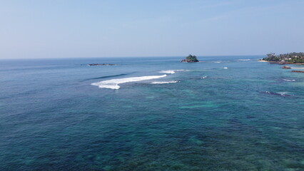 Obraz premium Sri Lanka Southern beaches captured by a drone. Indian blue ocean with clear blue sky, warm tropical temperature, 