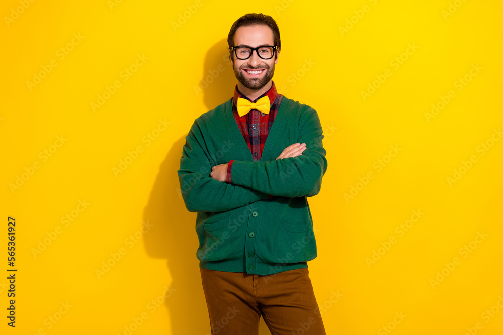 Sticker Photo portrait of young nice guy spectacles crossed arms beaming smile dressed stylish green clothes isolated on yellow color background