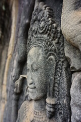 Fototapeta na wymiar stone relief, stone carving, dancer, temples in asia, cambodia, closeup, culture, memory of the past