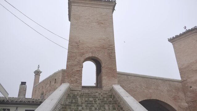 Movement towards the entrance to the tower placed on a bridge with ladders to climb up