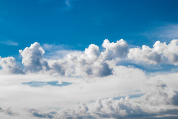 Stunning blue sky and fluffy clouds, perfect for backgrounds and nature themed projects.