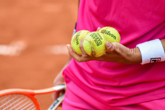 The body of a player about to serve with his racket and Wilson balls in his hands during the French Open, Grand Slam tennis tournament on May 24, 2022 at Roland-Garros stadium in Paris, France